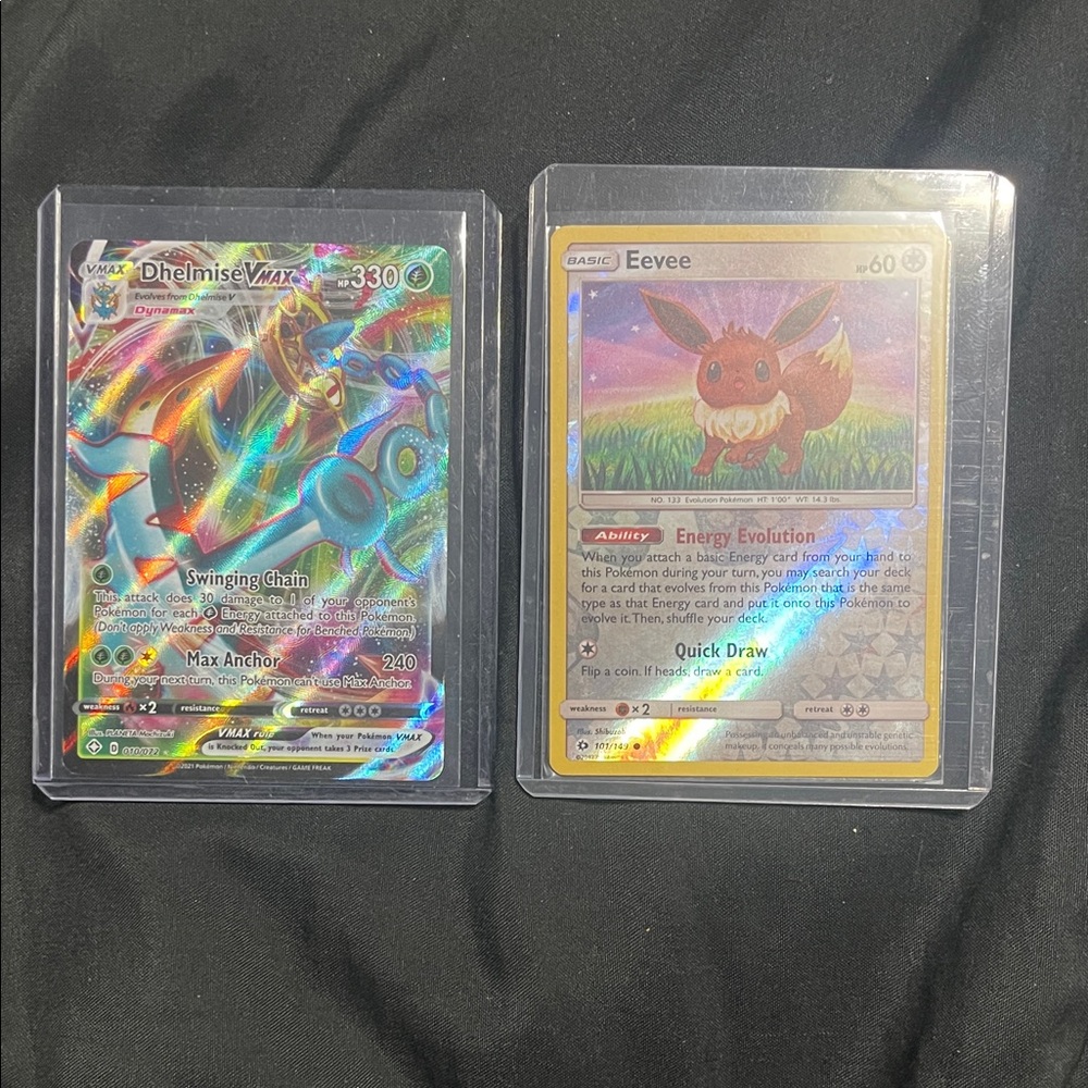 Pokemon Dhelmise VMAX and Eevee Holographic Cards